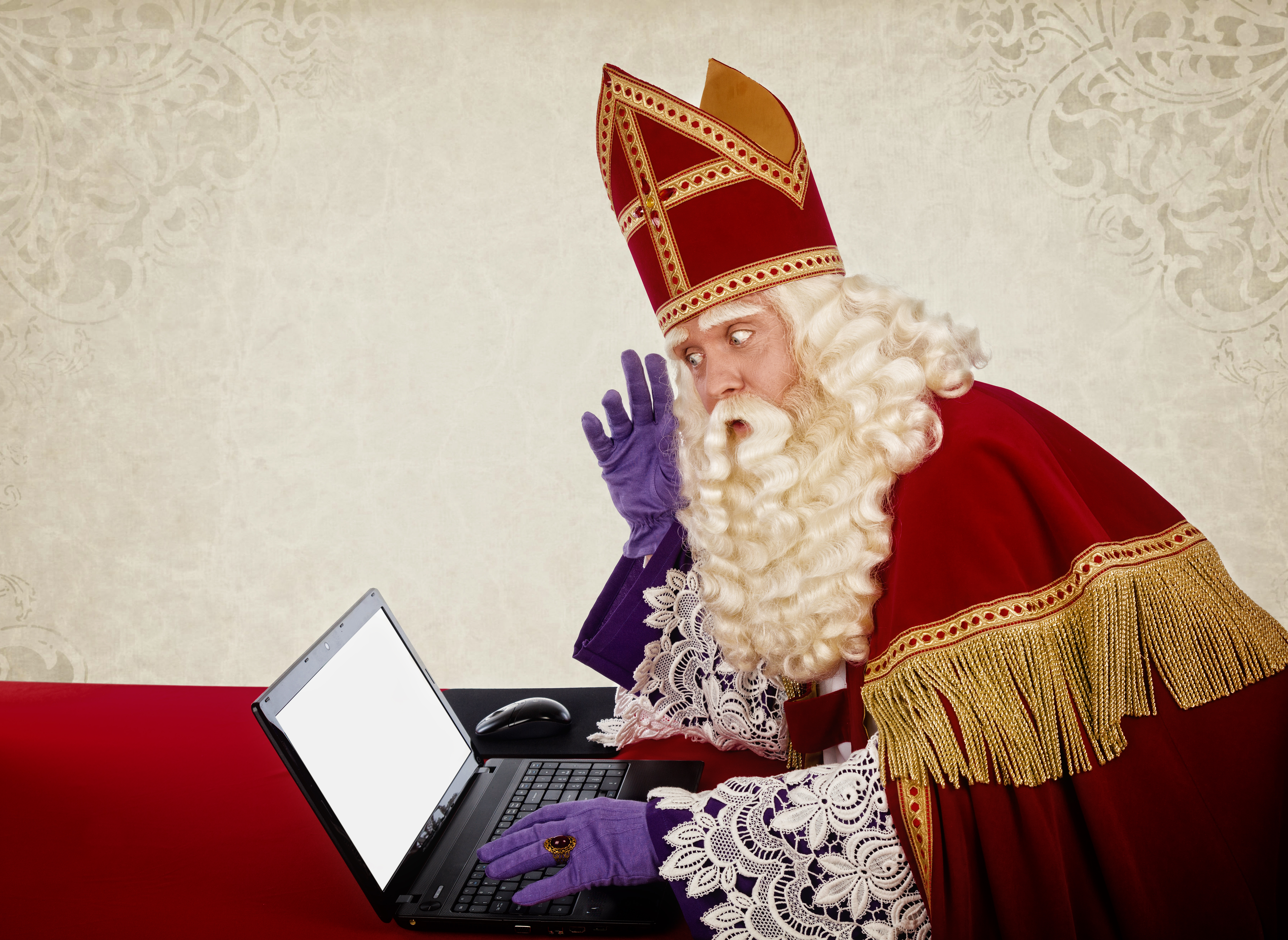 Sinterklaas looking on notebook. Vintage look. Dutch character o